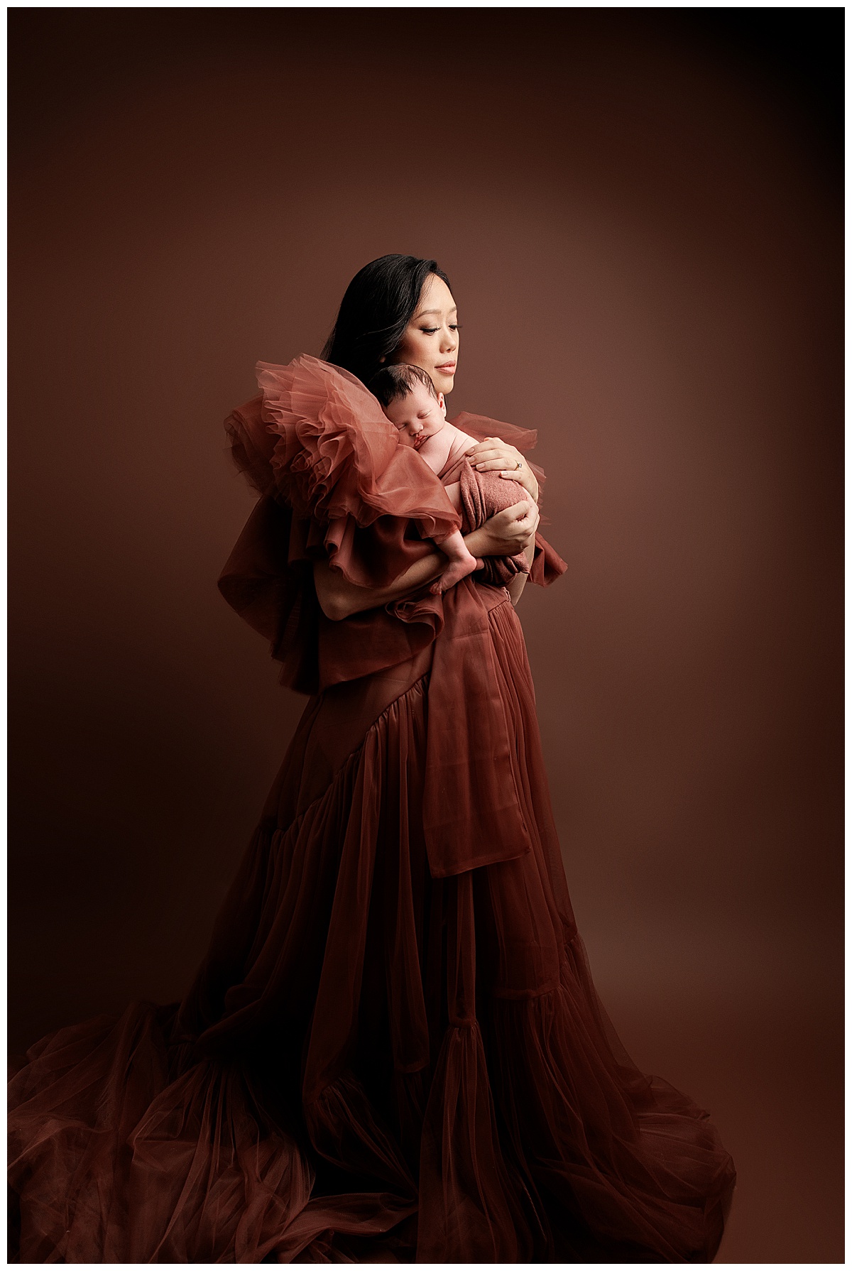 Mom holds sleepy newborn on her chest showing the Best Time For Your Newborn Session