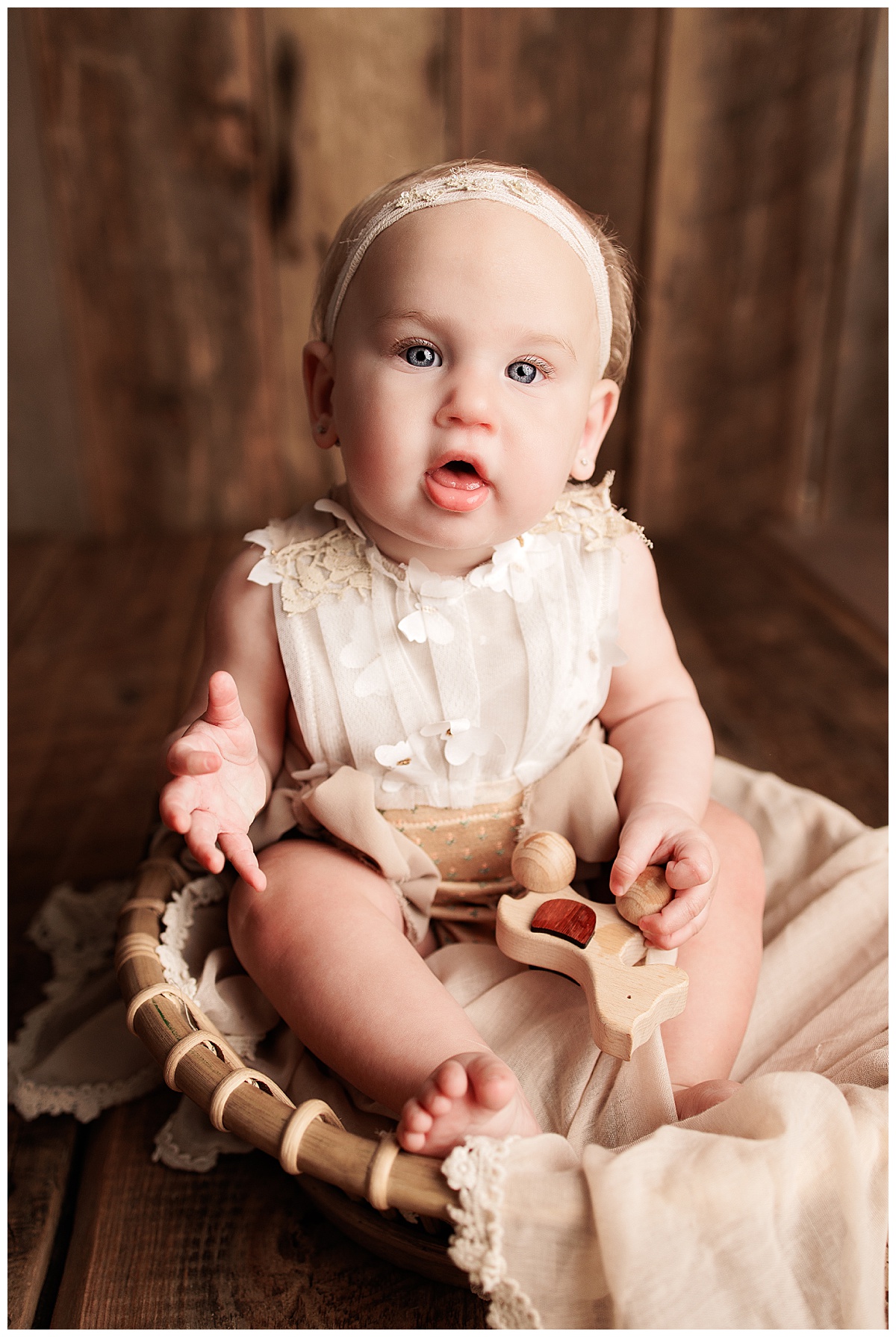 Young baby sits in a basket during her Baby Milestone Photos