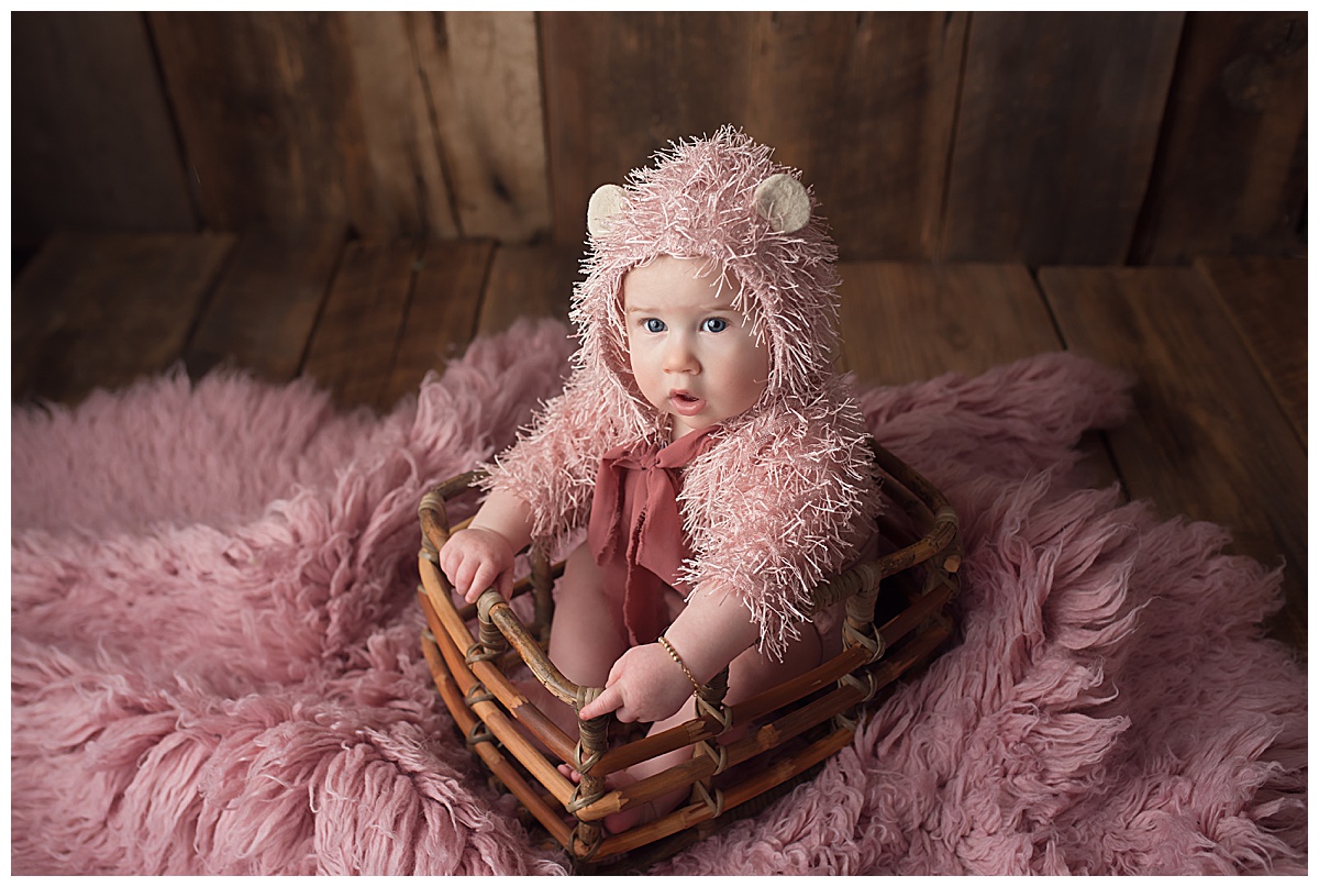 Baby wears pink outfit for Yaffa Koff Photography