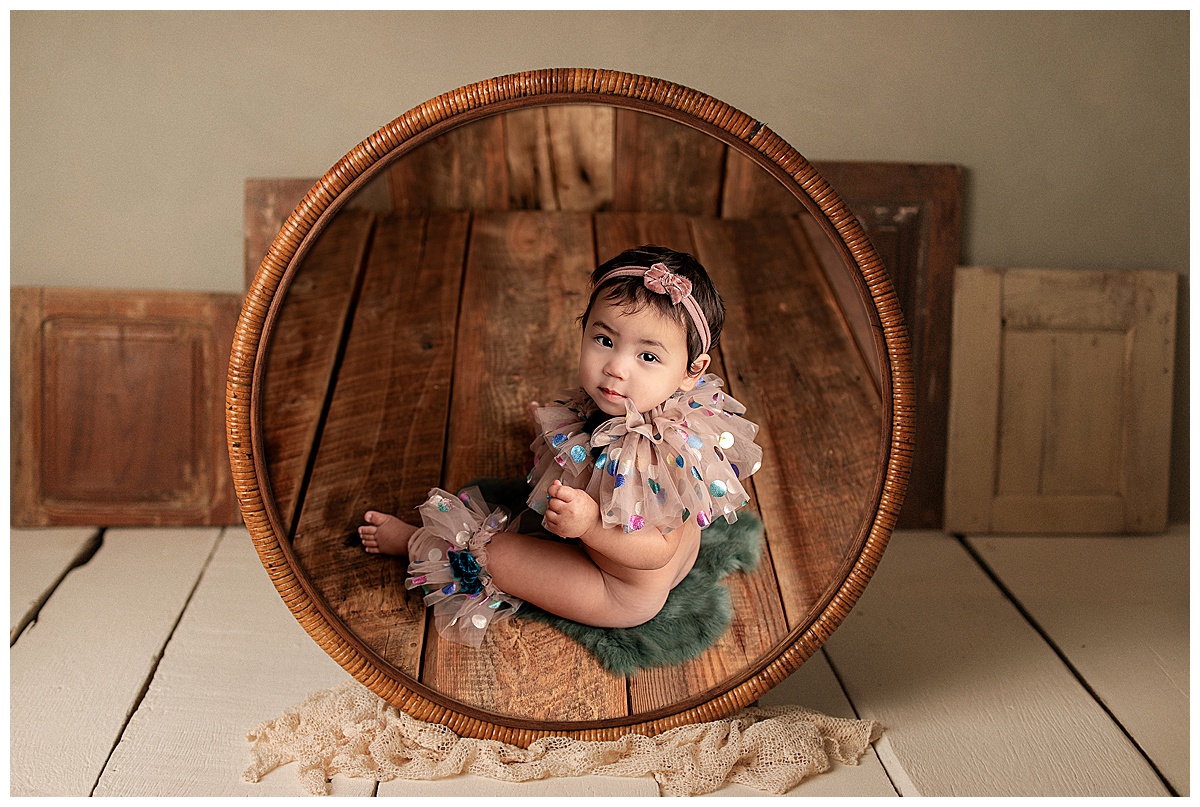 Client sees framed portraits of baby during their Reveal Session