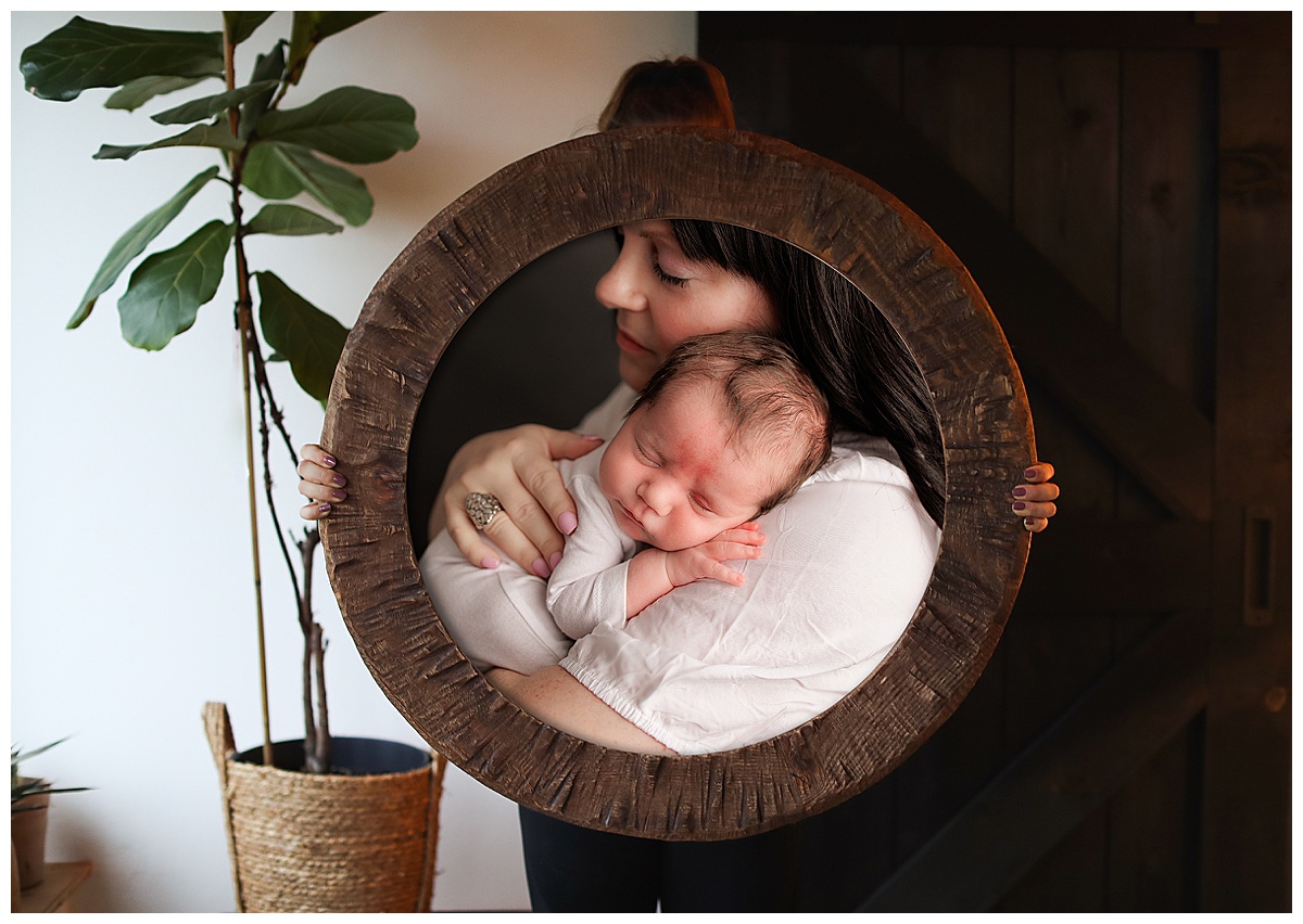 Framed portrait of mother and baby by Silver Spring Newborn Photographer