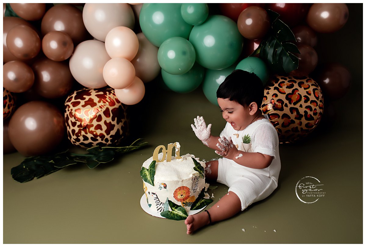 Young child makes a mess during a Cake Smash session