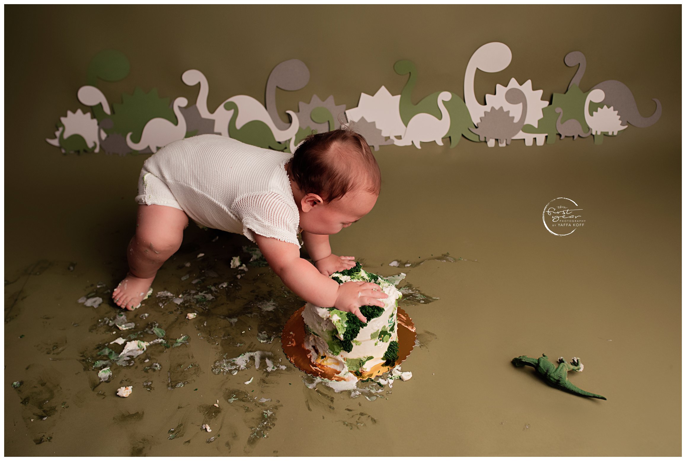 Baby eats some cake during a Cake Smash session