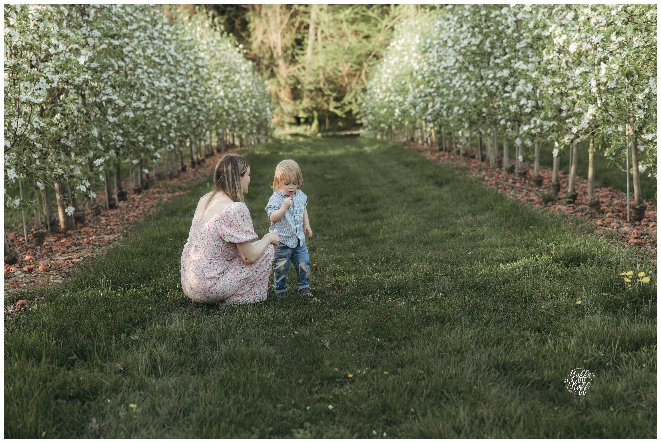 Mom and child have a quiet moment together during Family Portraits In The Spring 