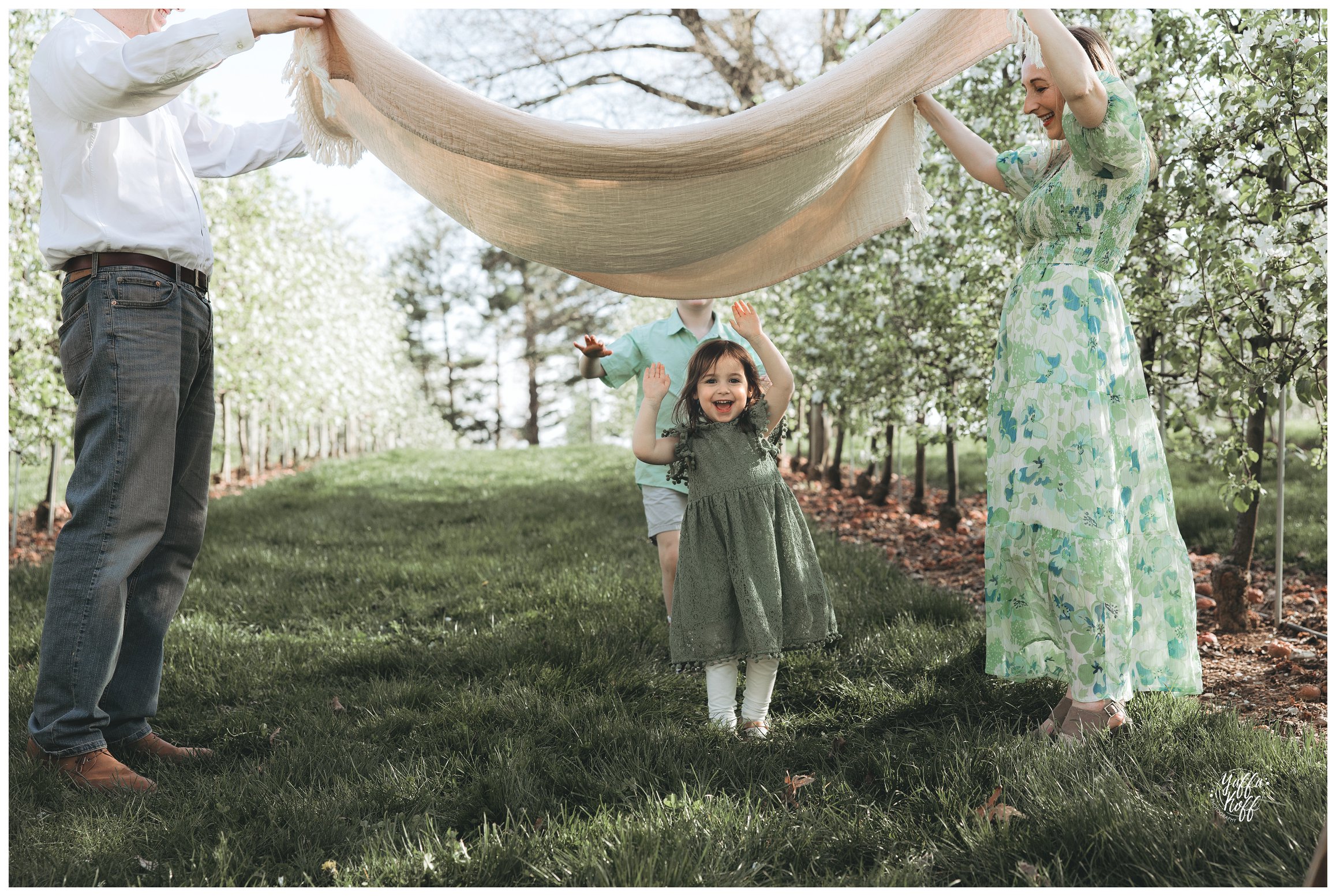 Children okay under tehe blanket for Silver Spring Family Photographer