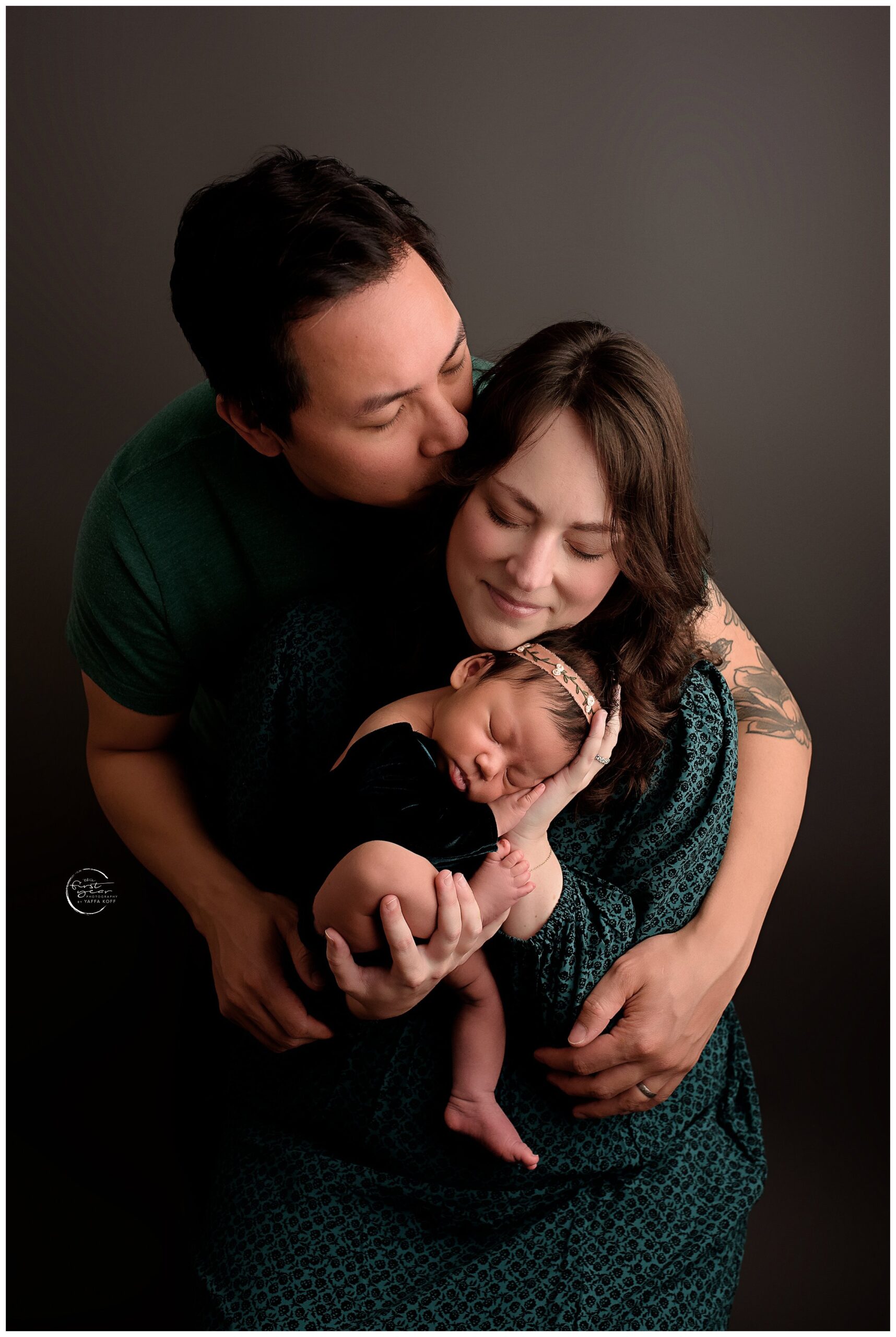 Parents cuddle sweet baby after wondering why Newborn Sessions Take So Long