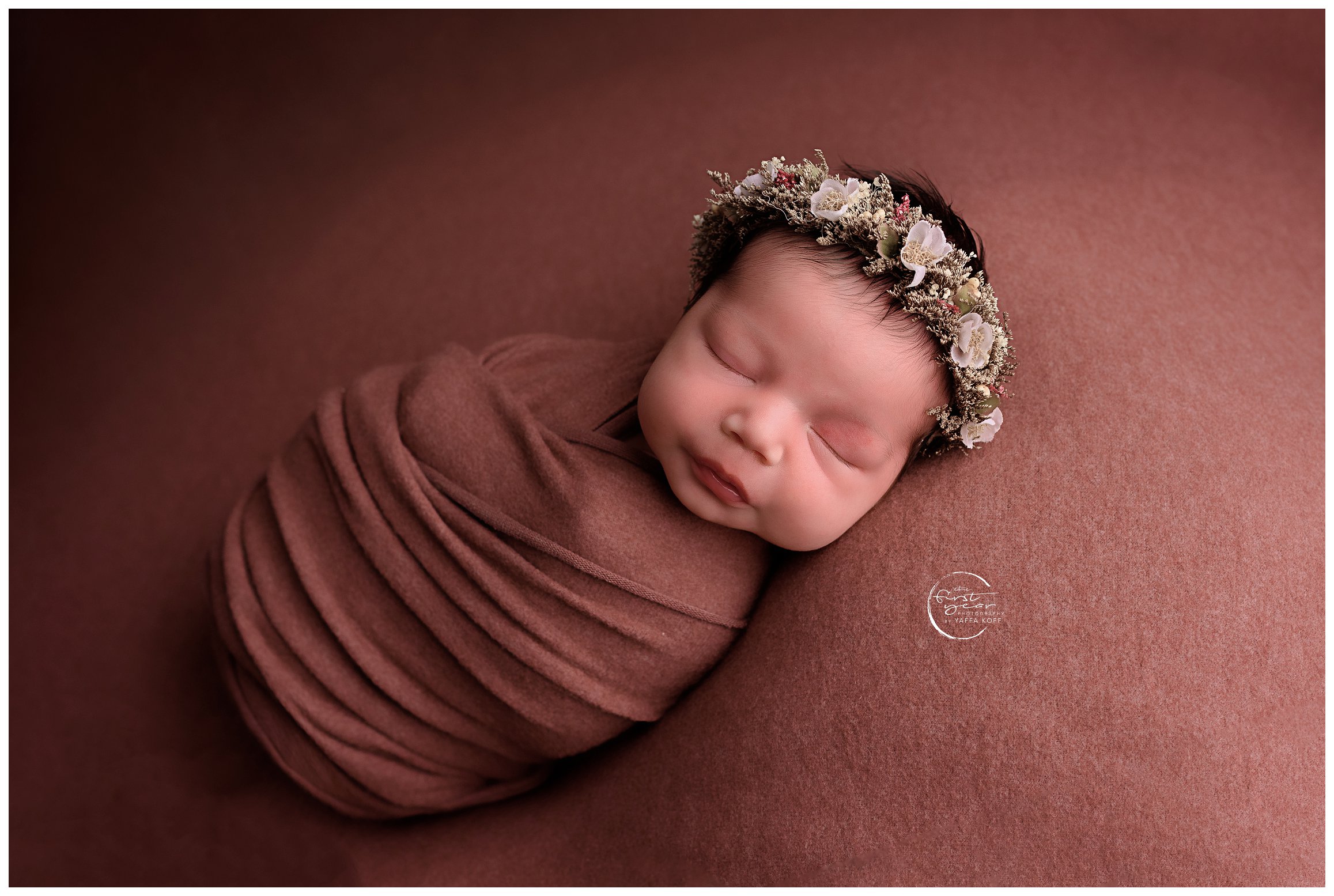 Parents lay baby in adorable wrap after wondering why Newborn Sessions Take So Long