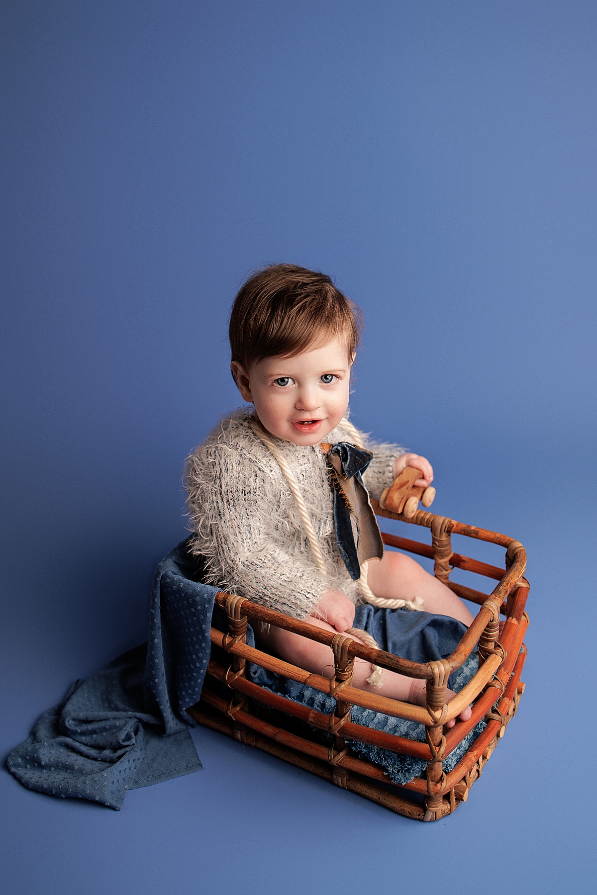 smiling baby in basket milestone session by silver spring newborn photographer