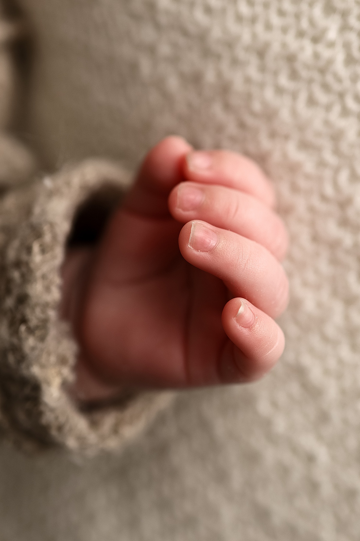 infant's little hand while sleeping by Silver Spring Photographer